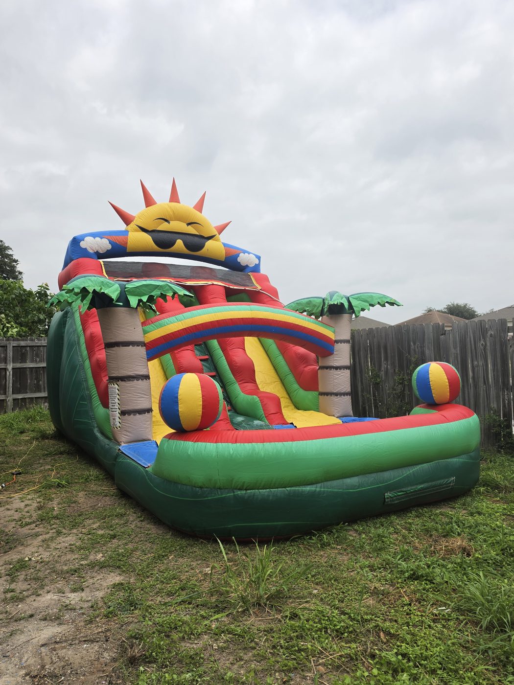 Red Sunshine — tropical water slide with beach balls and palm trees